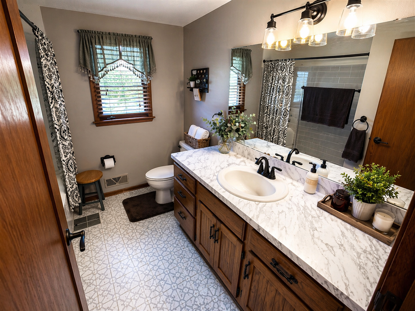 Albert Lea bathroom inspection — vanity, marble counter, and toilet evaluation