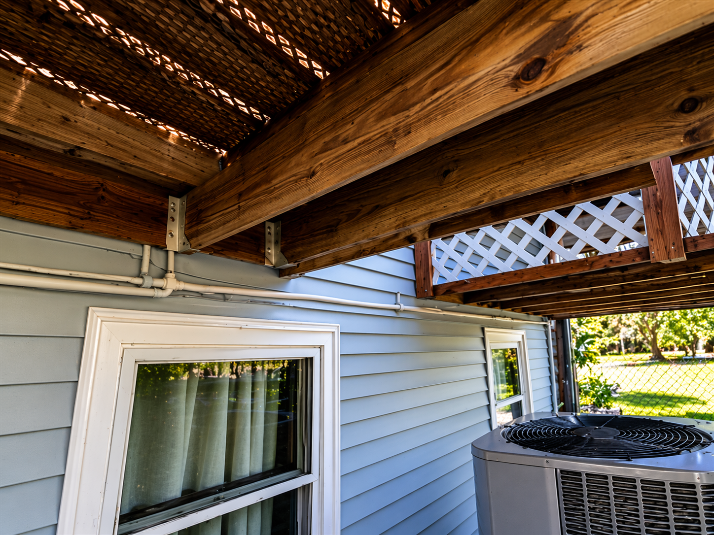 Albert Lea deck inspection — underside joists with AC condenser placement