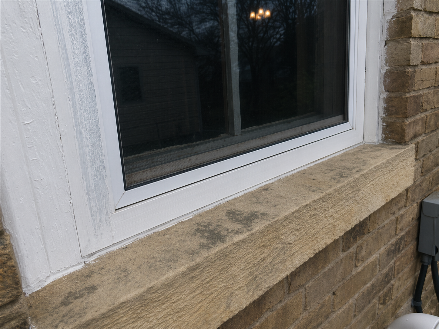 Albert Lea exterior inspection — brick exterior with peeling paint on window sill