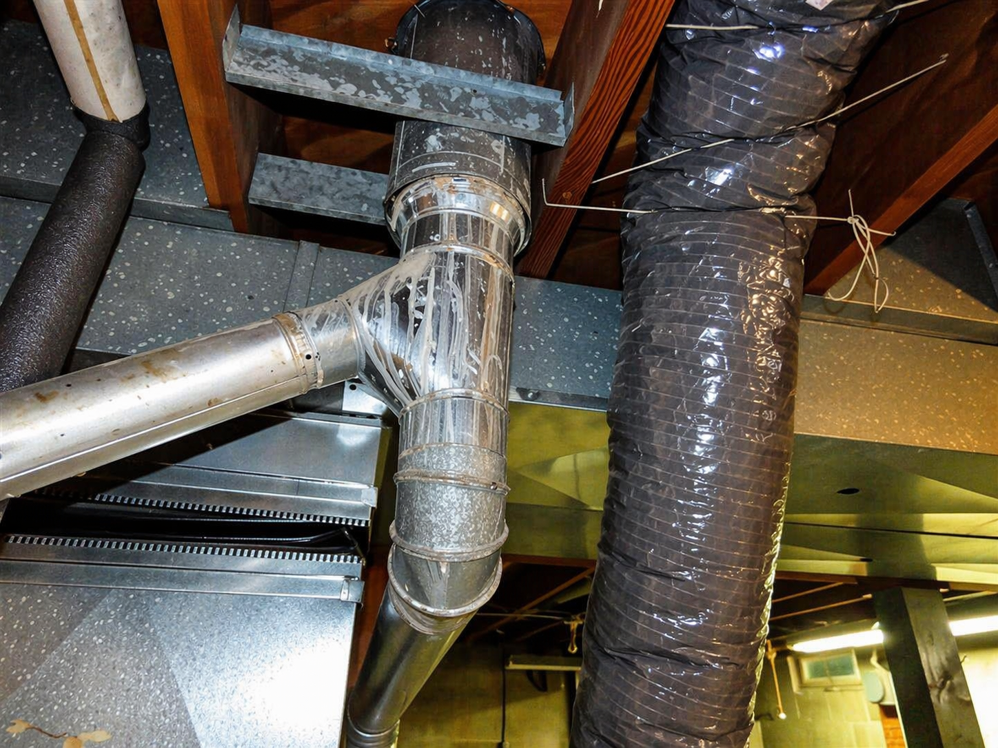 Albert Lea HVAC inspection — ductwork junction with flexible duct connection
