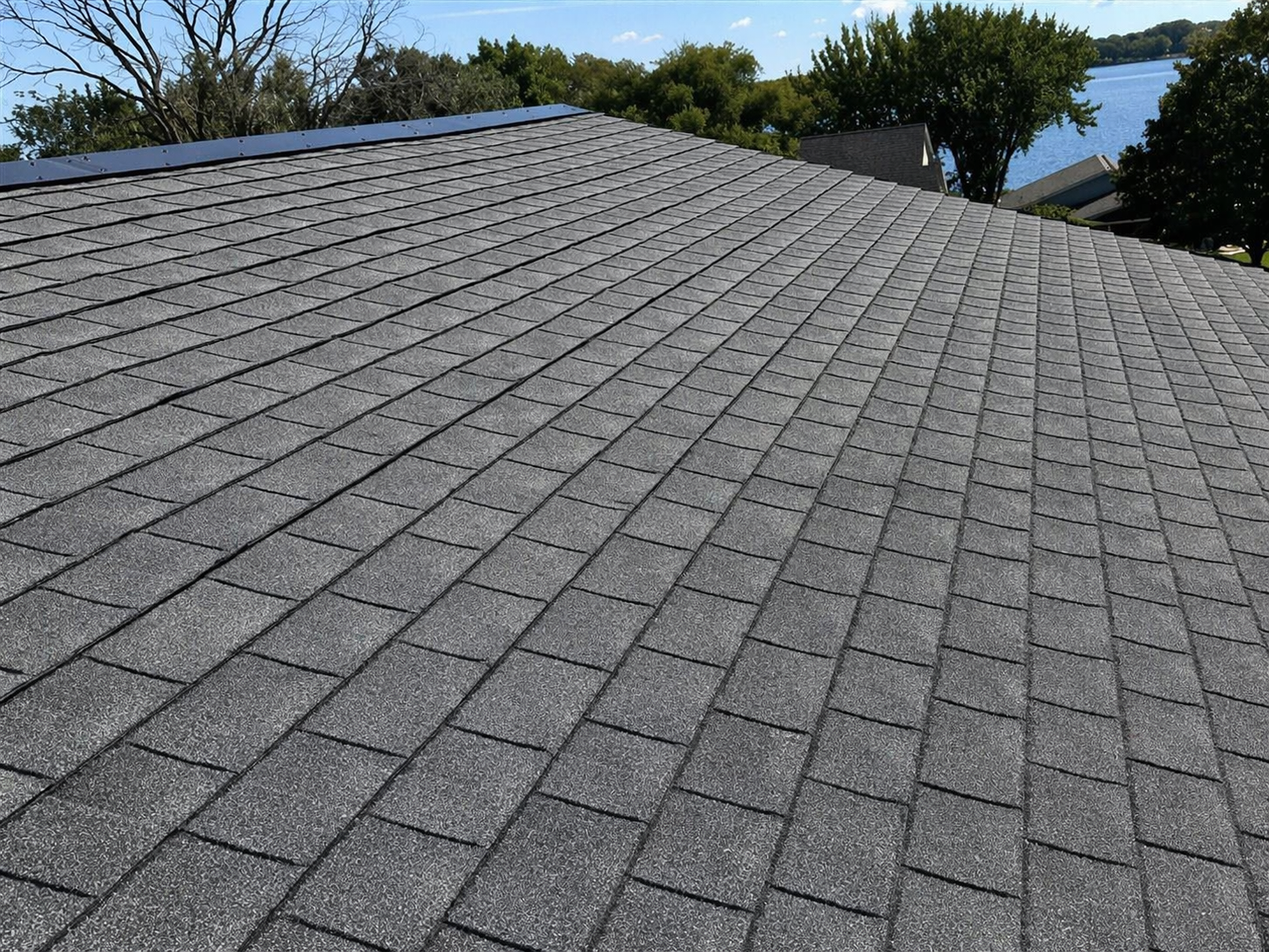 Albert Lea roof inspection — architectural shingles on a lakeside Minnesota home